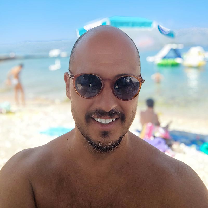 Bruno Filipović, owner and host of Freestyle Windsurf Center in Lumbarda, Korčula, welcoming guests to family-run Adriatic adventure activities