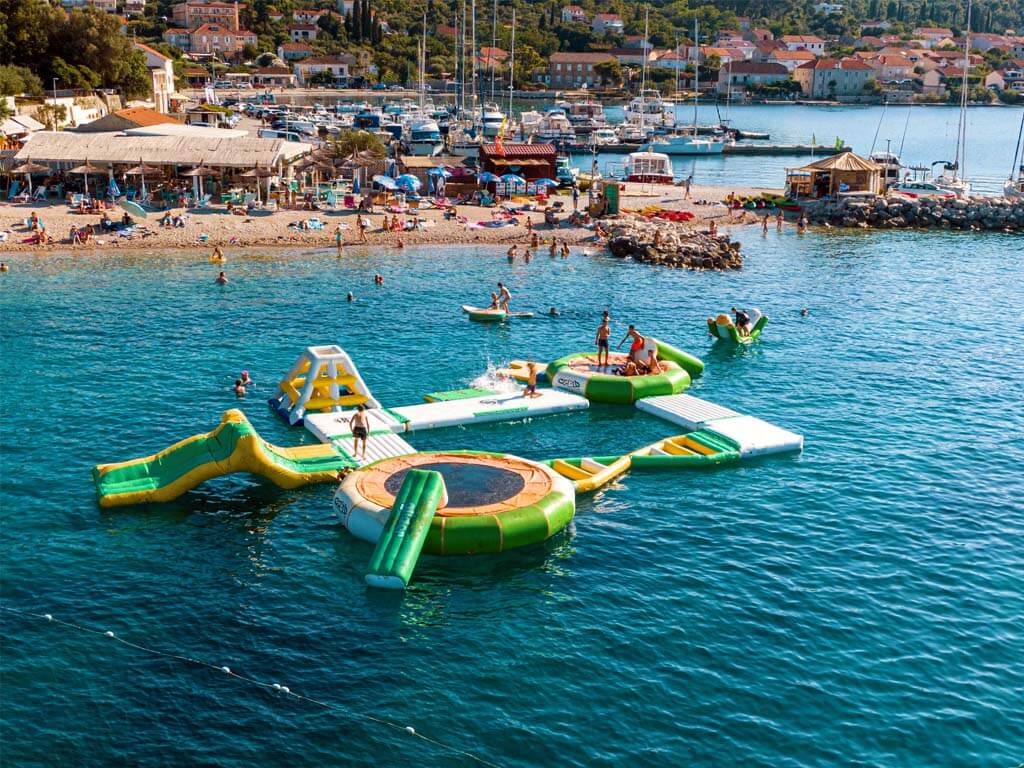 Floating Aquapark with slides and climbing platforms at Freestyle Windsurf Center, Lumbarda, Korčula